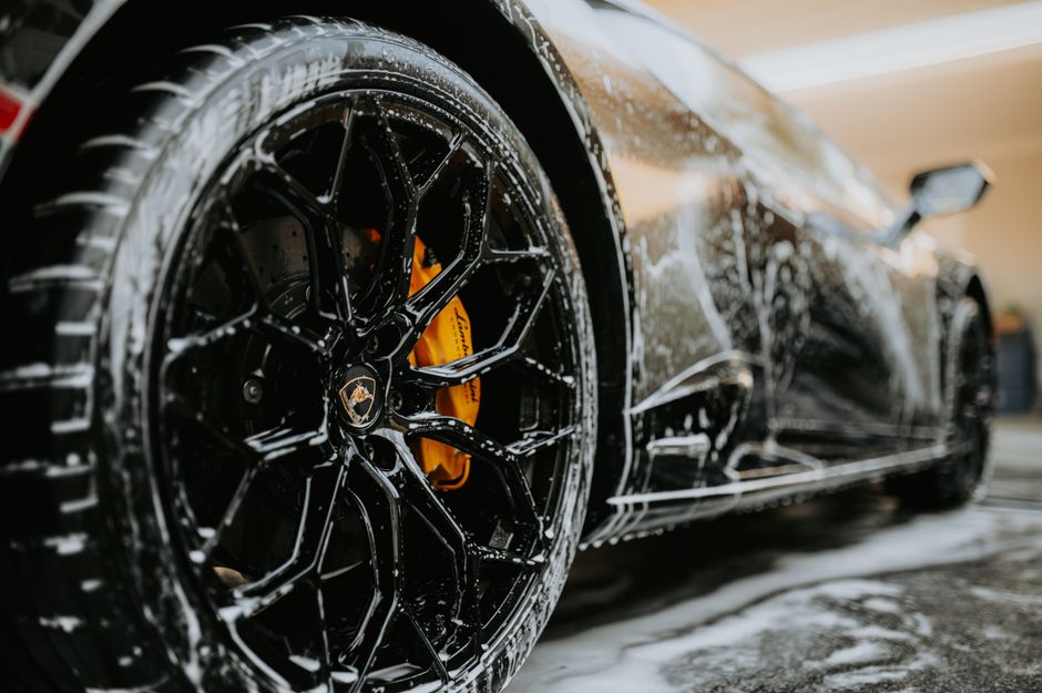 A freshly cleaned luxury vehicle parked outside